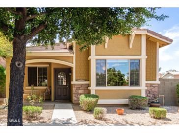 Charming single-story home with a cozy front porch and well-maintained landscaping at 4349 E Selena Dr, Phoenix, AZ 85050