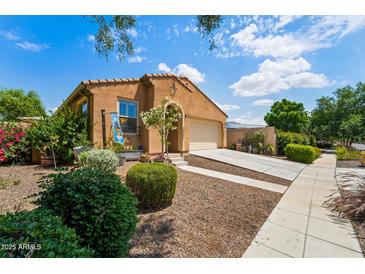 Charming single-story home with a well-maintained front yard and inviting curb appeal at 14916 W Georgia Dr, Surprise, AZ 85379