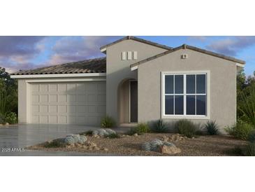 Charming single-story home featuring neutral tones, tile roofing and low-maintenance desert landscaping at 16932 W Desert Hollow Dr, Surprise, AZ 85387