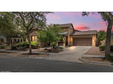 Charming home with a stone facade, manicured landscaping, and a two-car garage perfect for suburban living at 21014 W Cora Vista --, Buckeye, AZ 85396