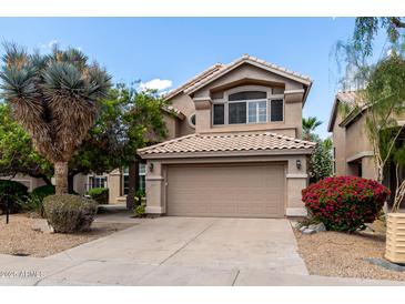 Charming two-story home featuring a well-maintained lawn, desert plants, and a neutral color palette at 236 W Calle Monte Vista Dr, Tempe, AZ 85284