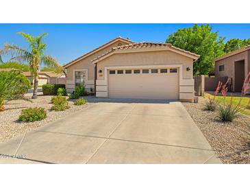 Charming single-story home featuring a well-maintained front yard and attached two-car garage at 3175 E Merrill Ave, Gilbert, AZ 85234