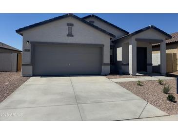 Beautiful single-story home with a two-car garage and a well-manicured, low-maintenance front yard at 3936 E San Jose St, San Tan Valley, AZ 85143