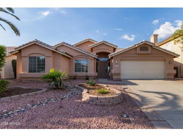 Charming single-story home with a well-maintained front yard and inviting entrance at 8606 W Caribbean Ln, Peoria, AZ 85381