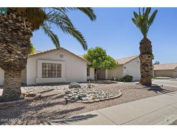 Charming single-story home featuring desert landscaping and a welcoming facade on a sunny day at 843 E Vera Ln, Tempe, AZ 85284