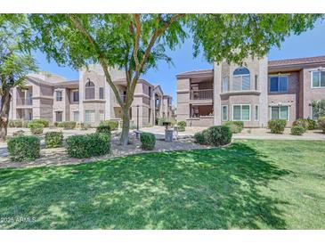 Inviting condo community featuring lush landscaping, mature trees, and well-maintained grounds at 17017 N 12Th St # 2117, Phoenix, AZ 85022