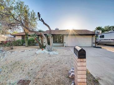 Charming single-story home features a low maintenance yard and a two-car garage at 19604 N 13Th Ave, Phoenix, AZ 85027
