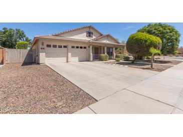 Charming single-Gathering home featuring a three-car garage and a well-manicured front yard at 3580 E Kesler Ln, Gilbert, AZ 85295