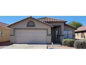 Charming single-story home with a two-car garage and well-maintained desert landscaping at 419 W Harwell Rd, Phoenix, AZ 85041