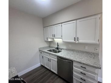 Modern kitchen with stainless steel appliances, granite countertops, and white cabinetry at 555 N May -- # 29, Mesa, AZ 85201