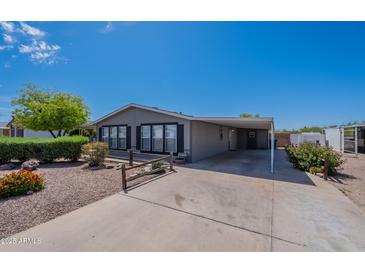 Charming single-story home with covered parking and well-maintained desert landscaping at 2807 W Gregory St, Apache Junction, AZ 85120