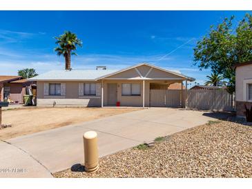 Cozy single-story home with a well-maintained front yard and private driveway at 4636 W Mission Ln, Glendale, AZ 85302