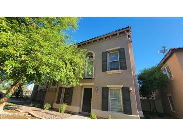 Charming two-story home featuring well-maintained landscaping and an inviting entryway at 5628 S 21St Pl, Phoenix, AZ 85040