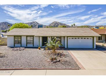 Charming single-story home with desert landscaping and mountain views in a sunny locale at 11210 S Bannock St, Phoenix, AZ 85044