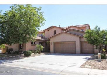 Charming two-story home with a three car garage and well-manicured landscaping at 1360 S Camellia Ct, Chandler, AZ 85286