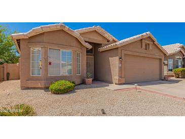 Charming single-story home with a low-maintenance desert landscape and a neutral color palette at 2247 E Ross Ave, Phoenix, AZ 85024