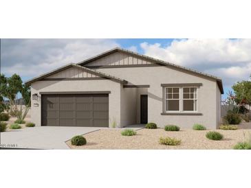 Charming single-story home with neutral stucco, dark trim, a two-car garage, and low maintenance front yard landscaping at 46819 W Cansados Rd, Maricopa, AZ 85139