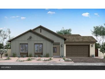 Charming single story home with a two car garage, low maintenance front yard and neutral colored exterior at 852 W Golden Ore Pass, Apache Junction, AZ 85120