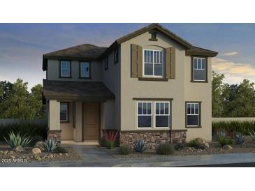 Charming two-story home featuring a stylish facade and well-manicured landscaping, creating great curb appeal at 9964 W Piccadilly Rd, Avondale, AZ 85392