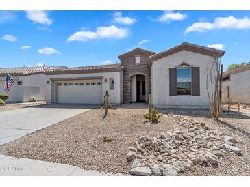 Charming single-story home with stone accents, desert landscaping, and a two-car garage at 5312 S Citrus Ct, Gilbert, AZ 85298