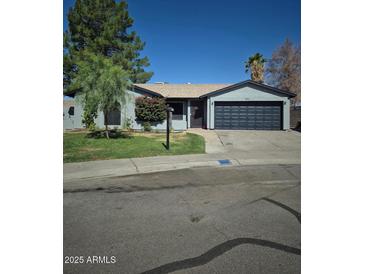 Charming single-story home featuring a two-car garage and well-maintained front yard at 696 W Shawnee Dr, Chandler, AZ 85225