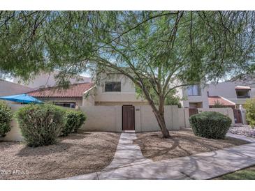 Charming two-story home with a private courtyard and lush desert landscaping at 9807 N 5Th St, Phoenix, AZ 85020