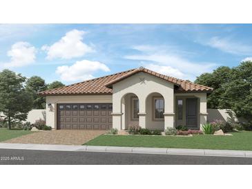 Charming single-story home featuring a tile roof, attached two-car garage, and beautifully landscaped front yard at 17383 W Fallen Leaf Ln, Surprise, AZ 85387