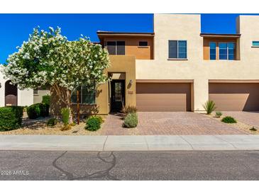 Charming two-story home with desert landscaping, a two-car garage, and a welcoming front entrance at 36145 N Desert Tea Dr, Queen Creek, AZ 85140