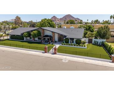 Charming single-story home with mature landscaping and mountain views at 4833 N 38Th St, Phoenix, AZ 85018