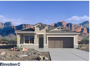 Charming single-story home with desert landscaping and a two-car garage at 4936 S 106Th Ln, Tolleson, AZ 85353