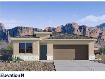 Charming single-story home featuring a two-car garage and mountain views at 4940 S 106Th Ln, Tolleson, AZ 85353