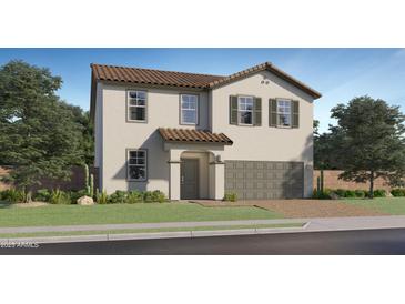 Charming two-story home features a tile roof, a two-car garage, and a well-maintained lawn at 9544 W Pinchot Ave, Phoenix, AZ 85037