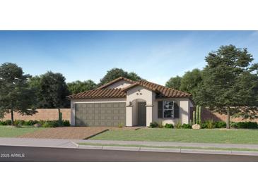 Charming single-story home with a two-car garage, tile roof, and well-manicured lawn at 9833 W Avalon Dr, Phoenix, AZ 85037