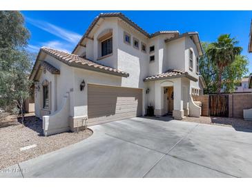 Inviting two-story home with a two-car garage, neutral stucco facade and well-maintained landscaping at 12107 N 66Th Ave, Glendale, AZ 85304