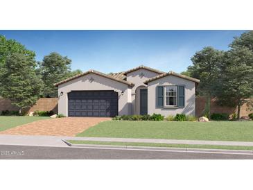 Charming single-story home with a two-car garage, desert landscaping, and a light-colored facade at 15782 W Kendall St, Goodyear, AZ 85338