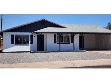 Charming single-story home featuring a new roof and fresh white paint at 5336 W Lewis Ave, Phoenix, AZ 85035