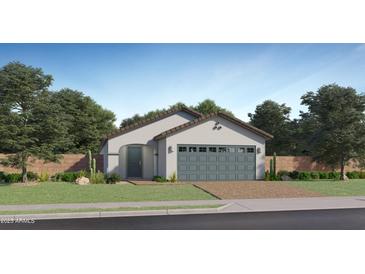 Charming single-story home with a well-manicured lawn and a two-car garage with a brick driveway at 9519 W Catalina Dr, Phoenix, AZ 85037