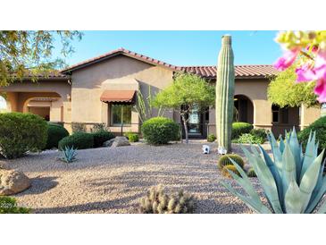 Charming exterior with a desert landscape, featuring a saguaro cactus and native plants at 9715 E Allison Way, Scottsdale, AZ 85262