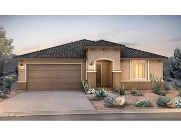 Charming single-story home with a two-car garage and desert landscaping at 18667 N 268Th Ave, Buckeye, AZ 85396