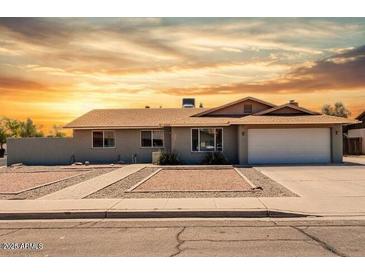 Charming single-story home featuring a two-car garage and low-maintenance landscaping in a desirable neighborhood at 2327 E Pebble Beach Dr, Tempe, AZ 85282