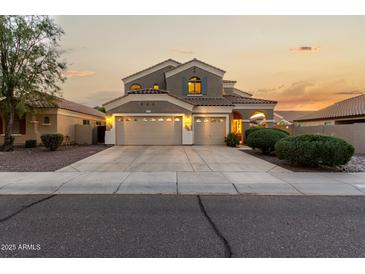 Beautiful two-story home featuring a three-car garage and well-manicured landscaping at 3634 S Danielson Way, Chandler, AZ 85286