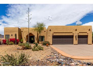 Charming home featuring a desert landscape, attached two-car garage, and barrel tile roofing at 5978 E Chuckwalla Trl, Cave Creek, AZ 85331