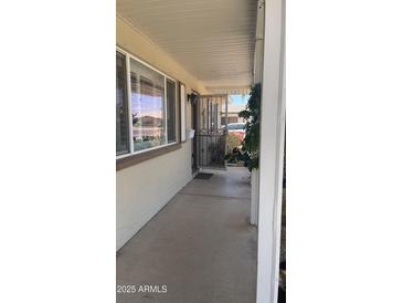 Inviting front porch with decorative security door and charming architectural details at 2137 W Del Campo Cir, Mesa, AZ 85202