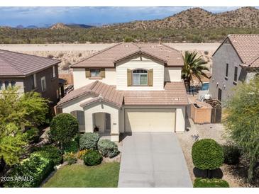 Charming two-story home featuring a desert landscaped yard and a two car garage at 29339 N 67Th Ave, Peoria, AZ 85383