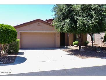 A lovely single-story home boasting desert landscaping and a two-car garage at 4747 E Narrowleaf Dr, Gilbert, AZ 85298