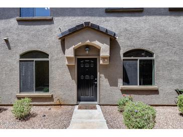 Inviting front entrance with a covered porch and well-maintained landscaping offering a warm welcome to residents and guests at 2250 E Deer Valley Rd # 24, Phoenix, AZ 85024