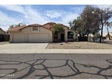 Charming single-story home with a three-car garage and well maintained landscaping at 3601 E Taro Ln, Phoenix, AZ 85050