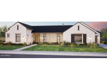 Charming single-Gathering home with a well manicured front yard, and stone facade at 5941 E Lafayette Blvd, Phoenix, AZ 85018