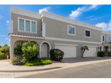Charming two-story townhome with two-car garage and well-maintained landscaping at 5232 N 16Th Ln, Phoenix, AZ 85015