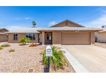 Charming single-story home with a two-car garage, desert landscaping, and beautiful curb appeal at 5320 W Maui Ln, Glendale, AZ 85306